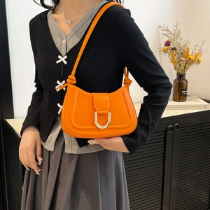 Retro bright orange leather shoulder bag for women with golden horseshoe buckle and knotted strap