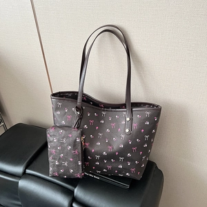Brown tote bag with pink bow pattern and matching pouch for women's daily commute