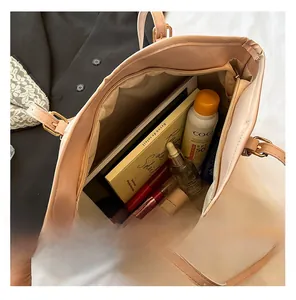 Detailed interior view of a large vintage tote bag showing ample space and zipper pocket