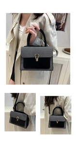 Detail of grey lychee textured crossbody bag with gold lock and adjustable strap