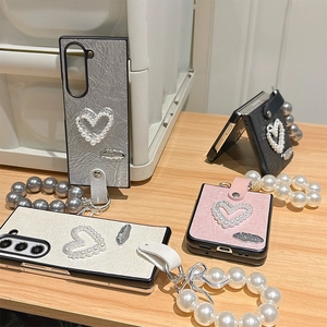 Quilted heart phone case for Samsung Z Flip with pearl wrist strap and bow detail