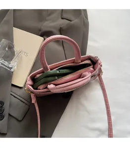 Top view of the pink crocodile pattern bag interior showing space for two smartphones