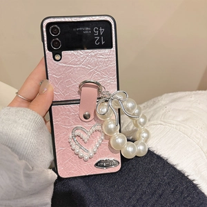 Pink pleated case for Samsung Z Flip with pearl heart design and a luxury pearl wrist strap