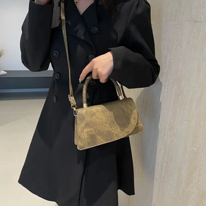 Minimalist vintage brown marble textured crossbody bag with metal buckles and handle
