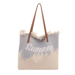 Canvas beach tote bag with Summer print, blue tassel trim and brown shoulder straps