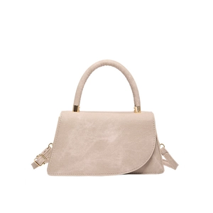 Minimalist beige trapezoid crossbody bag with a curved flap and golden metal hardware