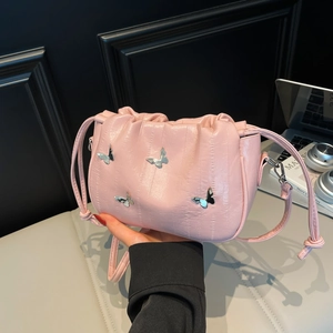 Chic pink pleated shoulder bag with silver butterfly accents and drawstring closure