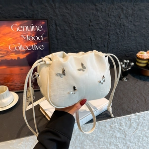 Elegant cream pleated shoulder bag with silver butterfly charms and chic cloud design