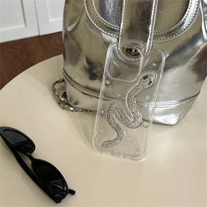 Transparent iPhone case featuring a sparkling silver rhinestone snake design with drop glue finish