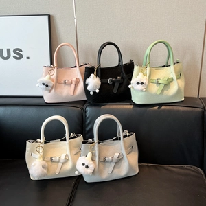 Minimalist woven texture handbags with wings design and cute monster pendants in five colors
