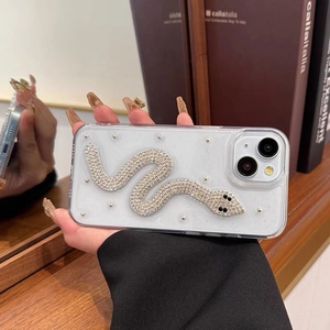 Detailed close-up of sparkling rhinestone snake design on glitter transparent phone case