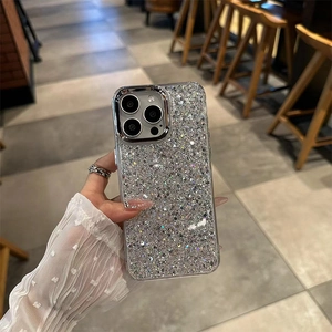 Close-up of glitter sequins texture on slim iPhone cover held in a cafe setting