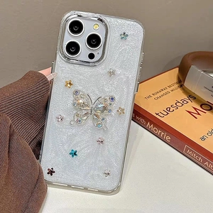 Detail of luxury rhinestone butterfly iPhone case with glitter and silver star accents
