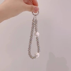 Close-up of pearl phone lanyard with rhinestone spacers and silver metal ring