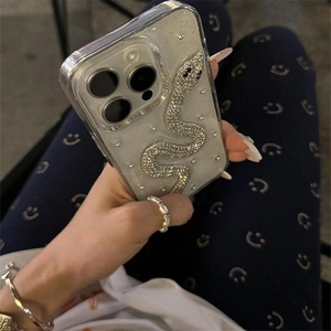 Detail of glitter silver snake decoration with rhinestones on clear iPhone case