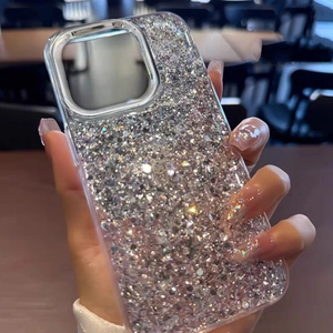 Sparkling silver glitter phone case for iPhone Pro Max series held in hand at cafe