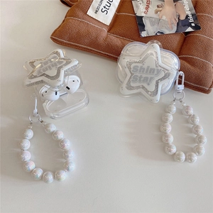 Star-shaped glittery AirPods case with pearl bracelet strap on a lifestyle background