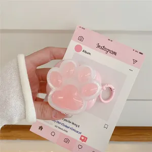 Detailed close-up of pink silicone cat paw case for AirPods with metal carabiner clip