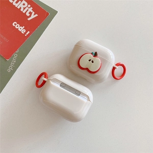 White AirPods protective case with 3D apple decor and red carabiner on textured background