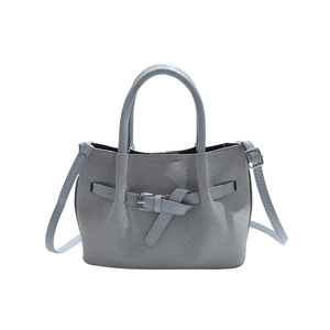 Light blue woven tote bag with silver buckle detail and adjustable shoulder strap