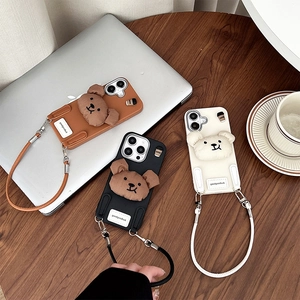 Chic iPhone 16 Pro Max silicone case with cute plush bear and matching wrist strap cord