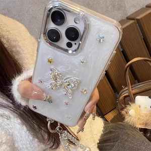 Detail of luxury iPhone case with rhinestone butterflies, flowers and pearl strap