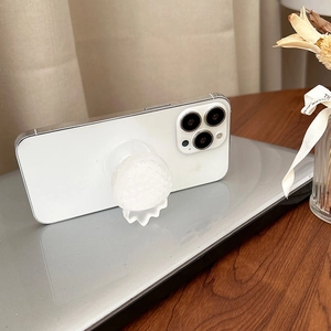 Collapsible strawberry phone grip holder in translucent white on a smartphone