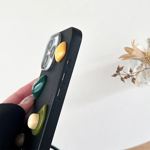 Macro side view of black leather iPhone case with colorful 3D abstract resin ornaments
