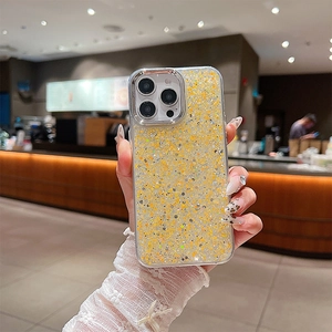 Macro detail of sparkly gold glitter texture on iPhone protective silicone phone case
