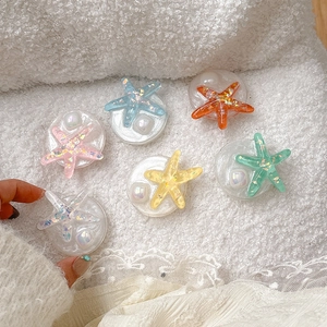 Sparkly starfish phone grip sockets in six vibrant colors with pearls and glitter