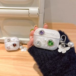 Sparkly AirPods Pro case with colorful rhinestones, pearls and butterfly charm decoration
