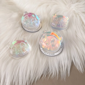 Set of four 3D holographic panda magnetic phone grips on soft white plush background