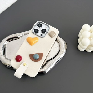Detail of cream leather iPhone case with colorful 3D geometric shapes and hand strap