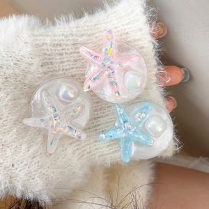 Glittery starfish resin phone grip set with pink and blue sequins for mobile phones
