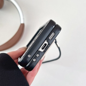 Detail view of precise bottom cutouts and lanyard hole on black matte flip phone case