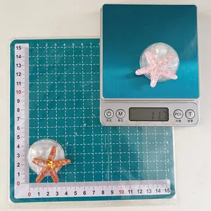 Detailed view of glitter starfish phone grip showing size measurement and 11.7g weight
