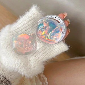 Macro view of iridescent panda magnetic phone grip with holographic resin finish