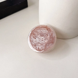 Detailed view of pink glitter phone socket with shimmering resin texture and clear sides