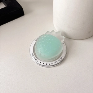 Detail of strawberry phone grip in mint green on Gift For You display card base