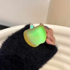 Macro view of a colorful apple-shaped collapsible phone grip with laser pearl finish