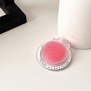 Close-up of pink strawberry phone grip featuring translucent matte texture and Gift For You text