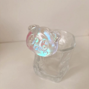 Macro detail of iridescent 3D panda phone grip with holographic finish on glass