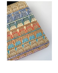 Detailed view of colorful rainbow woven texture and geometric patterns on a handmade bag