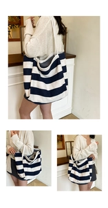Close-up of a large capacity blue striped canvas tote bag showing soft knit fabric texture