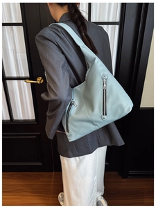 Detail of light blue lychee pattern tote bag showing side zipper and large capacity