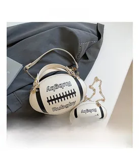 Detail showing creative rugby-shaped shoulder bag set with gold chain strap in cream white