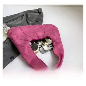 Interior view showing large capacity for phone and cosmetics in fuchsia tote bag
