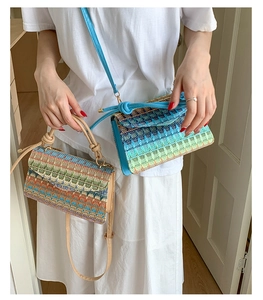 Detailed texture of geometric woven patterns on colorful ethnic style crossbody bags