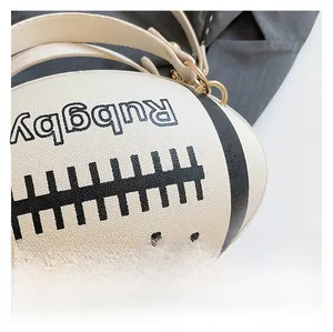 Macro shot of grainy lychee texture and football-shaped design on a black and white bag