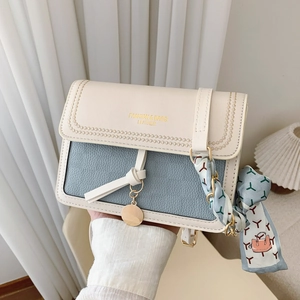 Contrast color crossbody flap bag with gold chain and silk scarf detail